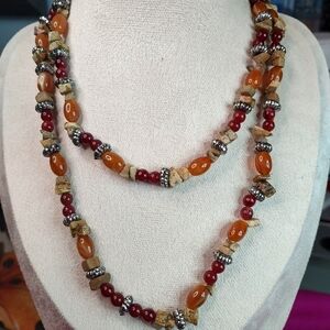 Earthy combination of warm-toned gemstones and decorative metal accents